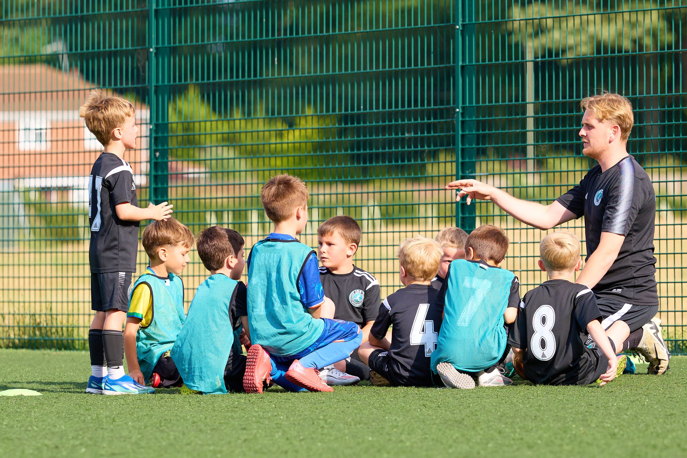 A JDA Academy squad gathered for a team talk