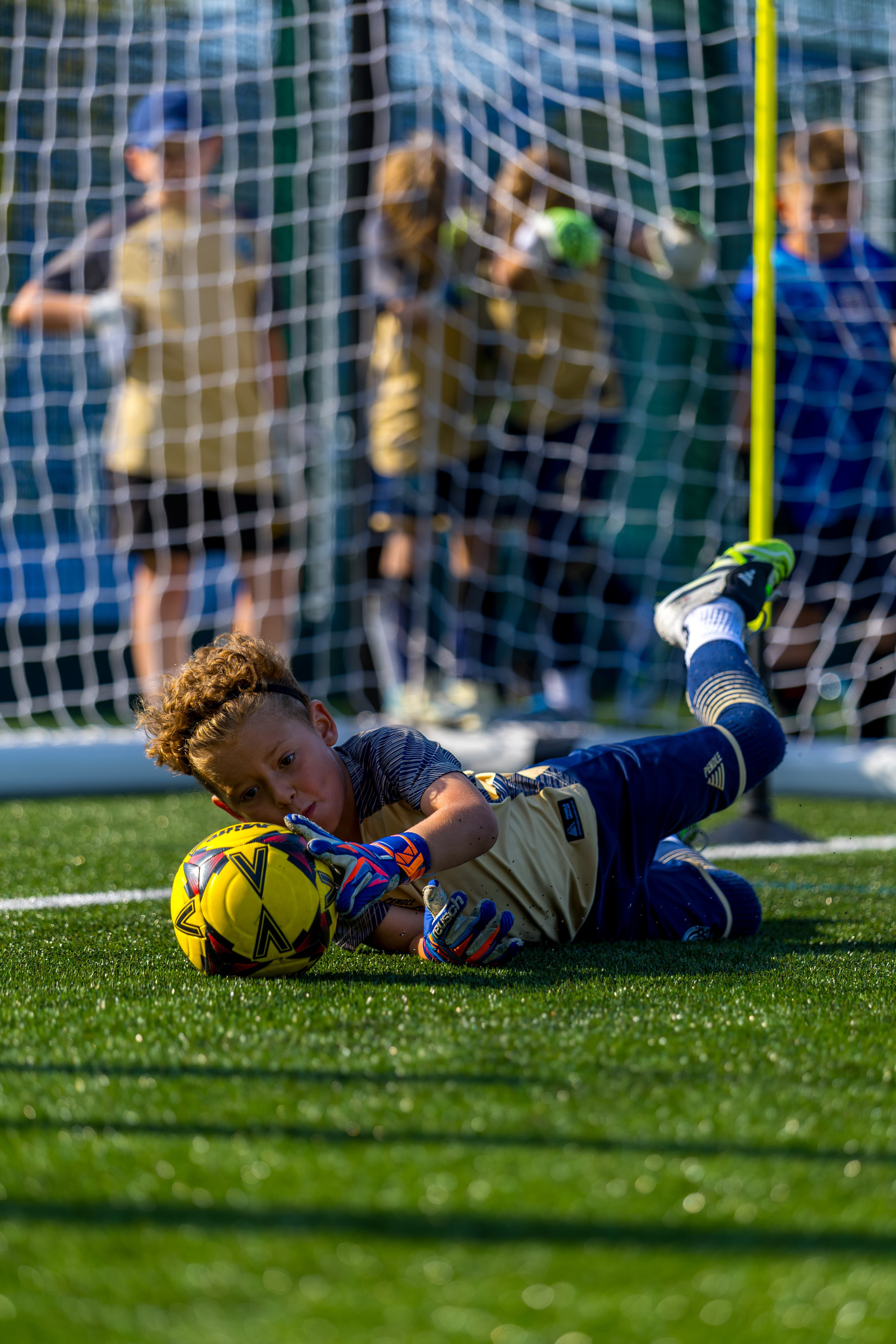 A JDA goalkeeper tipping the ball over the bar